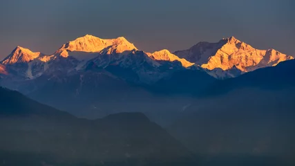 Wall murals Kangchenjunga A view of Snow clad Kangchenjunga, also spelled Kanchenjunga, is the third highest mountain in the world. It lies between Nepal and Sikkim, India,