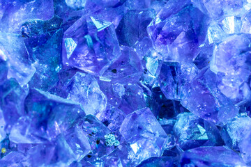 Blue Crystal Mineral Stone. Gems. Mineral crystals in the natural environment. Texture of precious and semiprecious stones. Seamless background with copy space colored shiny surface of precious stones