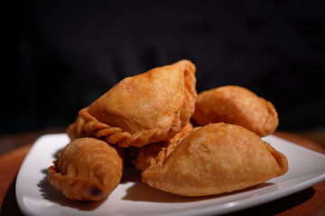 Curry puff snacks Traditional Thai desserts On the wooden table