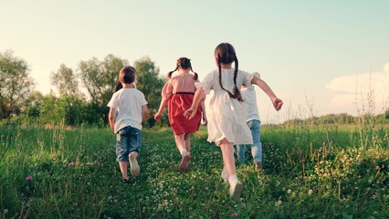 Kids , parents run in park, friends play in summer. Family, mom, dad, children, play together on weekends outdoors. Happy childhood dream, Concept. Happy boy girl run, play together, nature. Friends