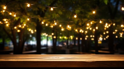 Empty wood table top with outdoor string lights hanging on tree in garden at night - fairy lights - obrazy, fototapety, plakaty
