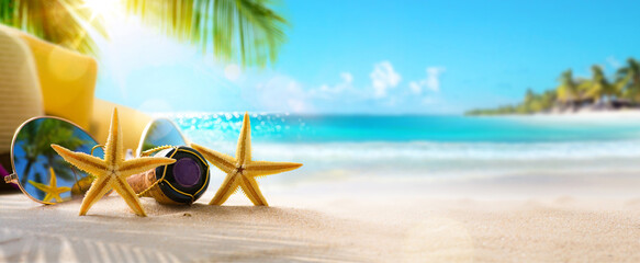 Honeymoon vacation on Sunny Tropical Sandy Beach With Palm Leaves And Paradise Island - obrazy, fototapety, plakaty