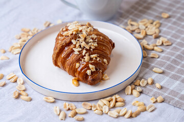 delicious croissant with peanuts and honey