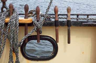 Mooring fairlead with round hole and black cast-iron ring with smooth rounding on ship.