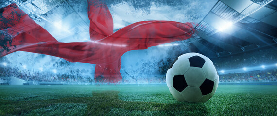 Soccer ball lying on sport stadium, grass with Danish flag on background symbolling Denmark team taking part in event. Concept of competition, championship, tournament, game event