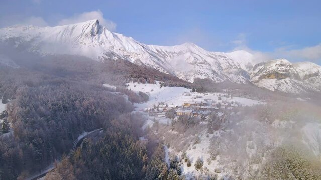 Winter aerial view of Laye ski resort in Champsaur with snow-covered Aiguille Peak. French Alps. Hautes-Alpes, France