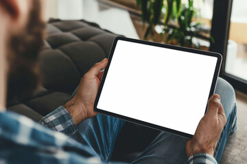 cropped view of man holding digital tablet with blank screen at home - obrazy, fototapety, plakaty
