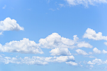 White clouds in a bright blue sky. The beauty of the nature	