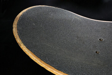 close up of skateboard deck on a black background © pulia