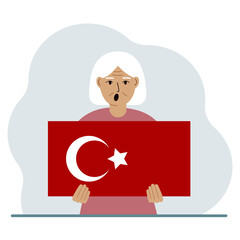 A woman holds a Turkish flag in his hands. Concept for demonstration, national holiday, Turkey day or patriotism. Nationality.