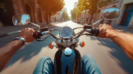 Selbstklebende Fototapeten POV shot of young man riding on a motorcycle. Hands of motorcyclist on a street © Orxan