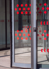 Revolving doors with a wheelchair button for disabled access