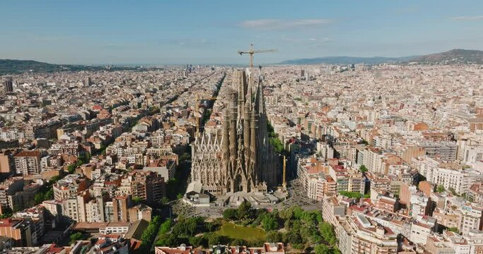 Eixample residential district Barcelona, Spain Geometric architecture sunrise summer drone slide back. Go Everywhere. Travel. Aerial view residential buildings city blocks and boulevards. Tourism
