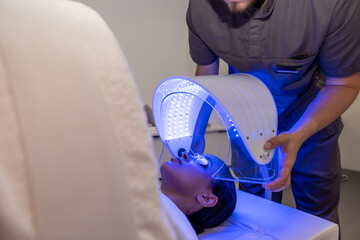 Customer in a beauty salon having a session of phototherapy