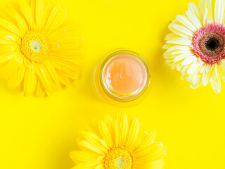 Open pink gel cream peeling jar on yellow background - 717871063