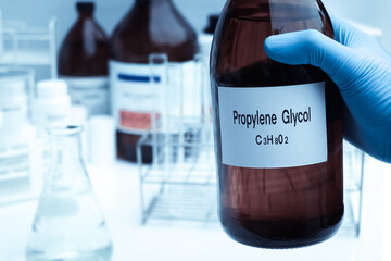 Propylene glycol in container, chemical analysis in laboratory. (AdobeStock 717871265)