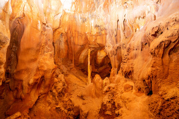 Underground interior of the Coin Cave with lake, stalactites, stalagmites and other rock formations.Vila de Ourém