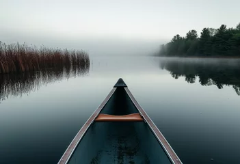 Poster Bow of a canoe in the morning on a misty lake © Angs