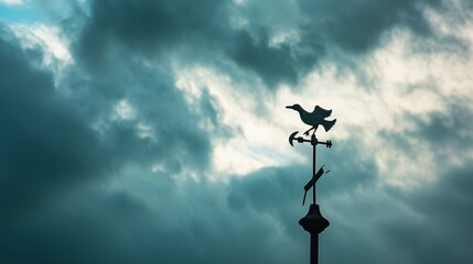 Fototapeta na wymiar A photo of a weather vane against a stormy sky, suitable for meteorology or climate-related news 