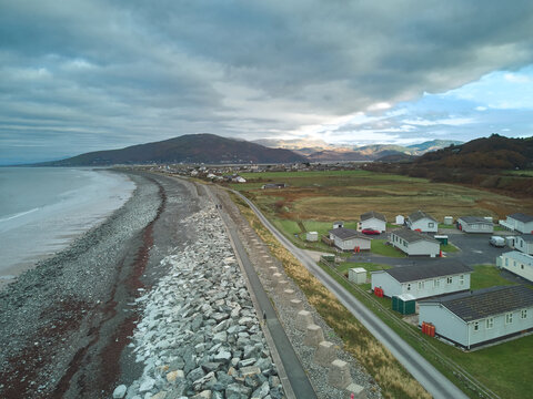 Aerial view of Fairbourne, a coastal village threatened by sea level rise and coastal erosion, North Wales, UK
