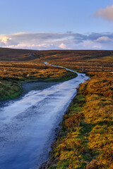 lonely road across moorland in the UK