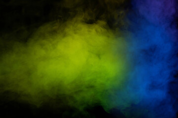 Yellow and green steam on a black background.