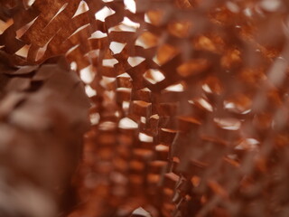 Paper filler for parcels. Kraft brown honeycomb packaging paper with slots. Crumpled craft paper close up. Recycled construction paper. Place for text. Copyspace. Textured background. Selective focus