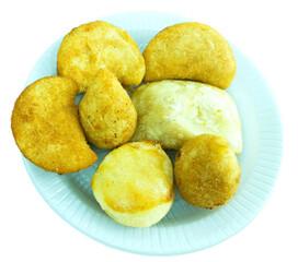 A plate with Brazilian savory snacks like rissole, Croquettes, coxinha, fried pastry, patty, snack