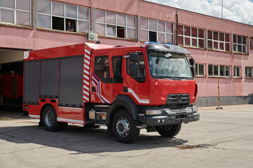 A state-of-the-art firetruck, equipped with advanced rescue technology, stands ready with its skilled firefighting team, prepared to intervene and respond rapidly to emergencies, ensuring the safety