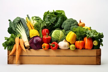 a box full of fresh organic vegetables on a white background