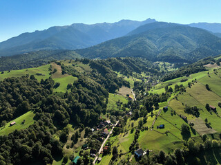 An aerial view above the village of Șimon in Bran commune, Brașov County, Romania. The image...