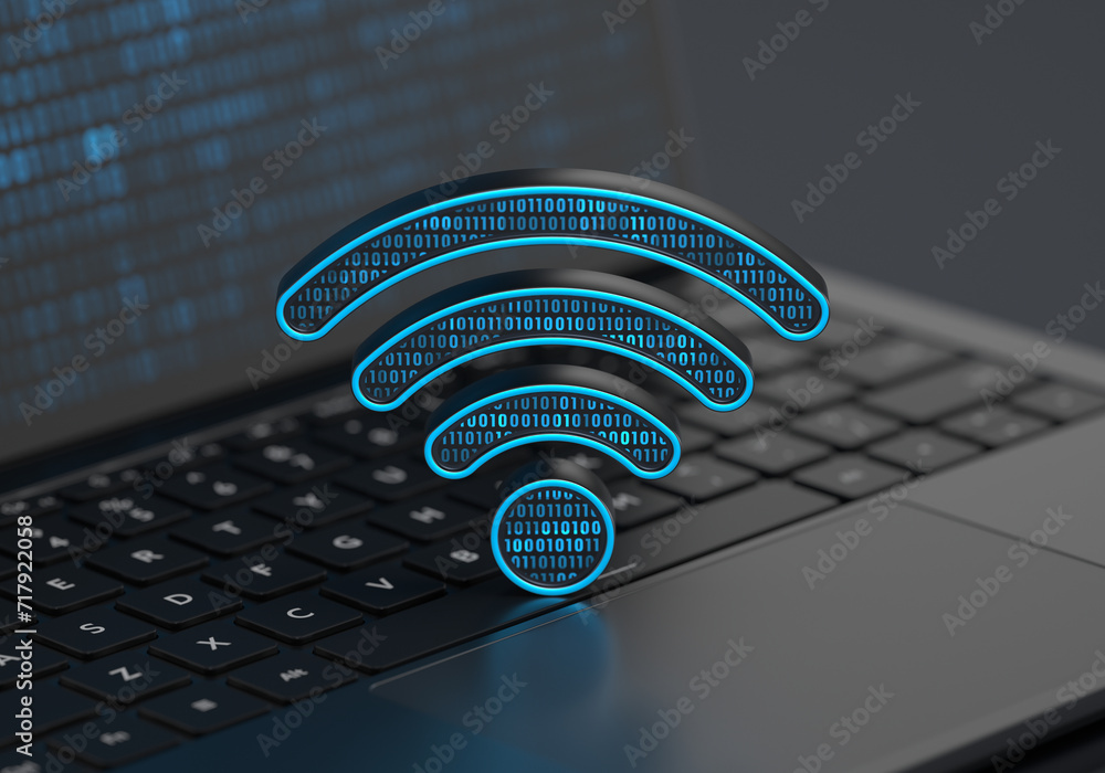 Poster a digital wi-fi internet icon placed on a laptop keyboard with soft depth of field on a dark backgro