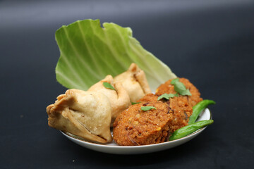samosa or singara. Traditional fried or baked isolated on black background.