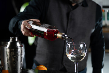 Bartender Pours Red Bitter Alcoholic Liqueur, Preparing Bicicletta Cocktail.