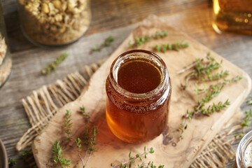 A jar of homemade thyme syrup for cough