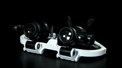 glasses 2XLED watch jeweler repair loupe on black background