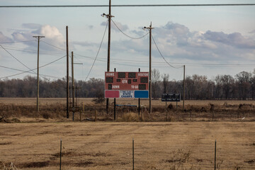Scoreboard sitting in at the back of abandoned football field - 717964245