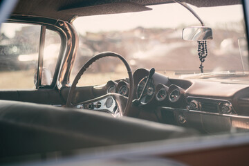 Vintage car interior with steering wheel and dashboard. Retro car background - obrazy, fototapety, plakaty
