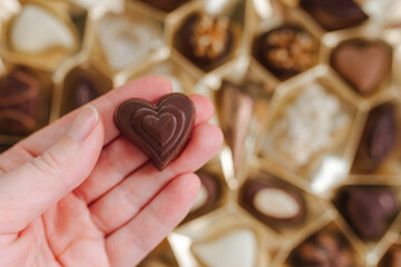 Assortment of fine chocolate candies, white, dark and milk chocolate. Sweets background. Top view.