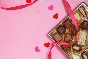 Assortment of fine chocolate candies, white, dark and milk chocolate. Sweets background. Top view.