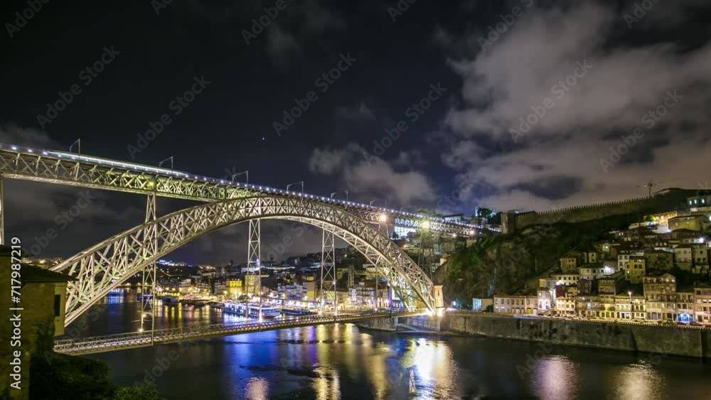 Wall mural the dom luis i bridge illuminated at night timelapse panorama. metal arch bridge that spans the dour