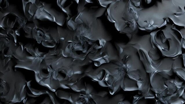 Layered, dark organic forms resembling petal-like structures. Deep shadows and subtle highlights create depth and dimension. Smooth, undulating surfaces with overlapping elements. 