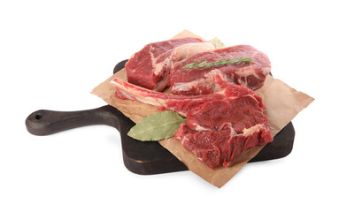 Board with pieces of raw beef meat and spices isolated on white