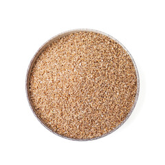 Dry wheat groats in bowl isolated on white, top view
