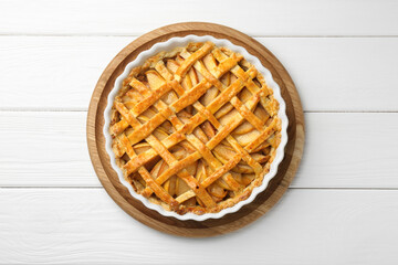 Tasty homemade quince pie on white wooden table, top view