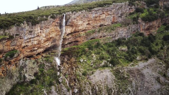 Drone shot of Tithorea Falls in Velitsa Gorge on a sunny day in Tithorea, Amfikleia-Elateia, Greece