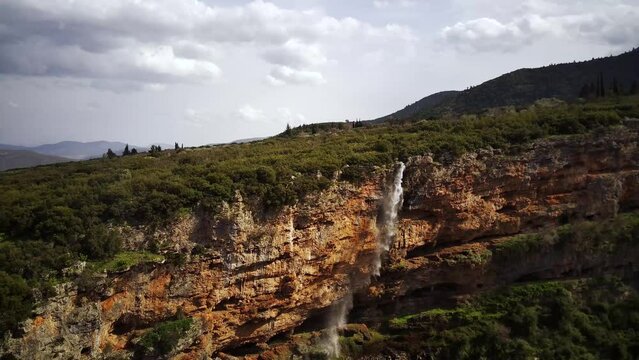 Drone footage of Tithorea Falls in Velitsa Gorge on a sunny day in Tithorea, Phthiotis, Greece
