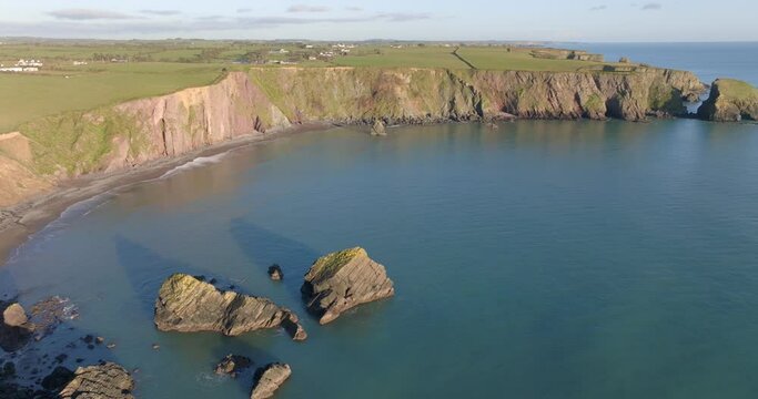 drone golden hour hidden bay with sea stacks at Copper Coast waterford Ireland