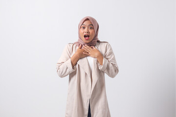 Portrait of frightened Asian hijab woman in casual suit making shocked hand gesture, showing surprised and scared expression. Isolated image on white background