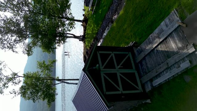Drone shot of a couple paddleboarding nature landscape in Lake Elmore, Vermont.